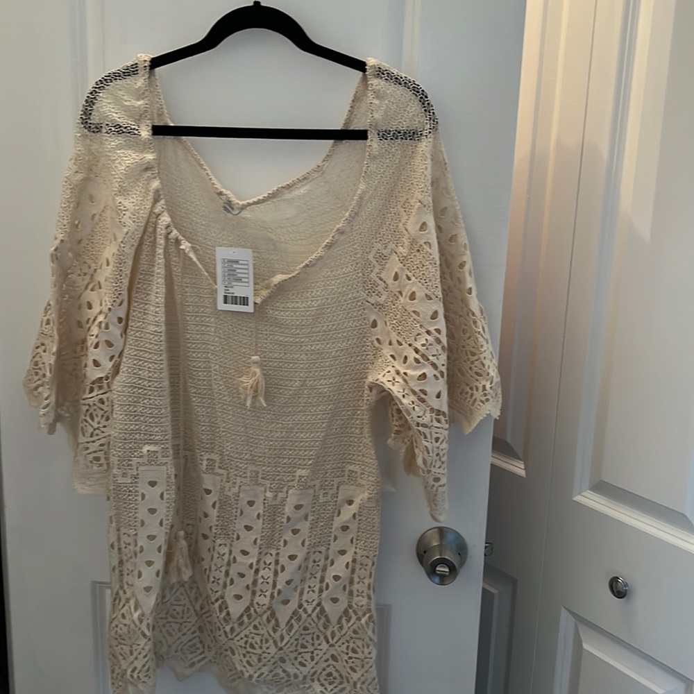 It’s a crocheted bathing suit color cream beige.